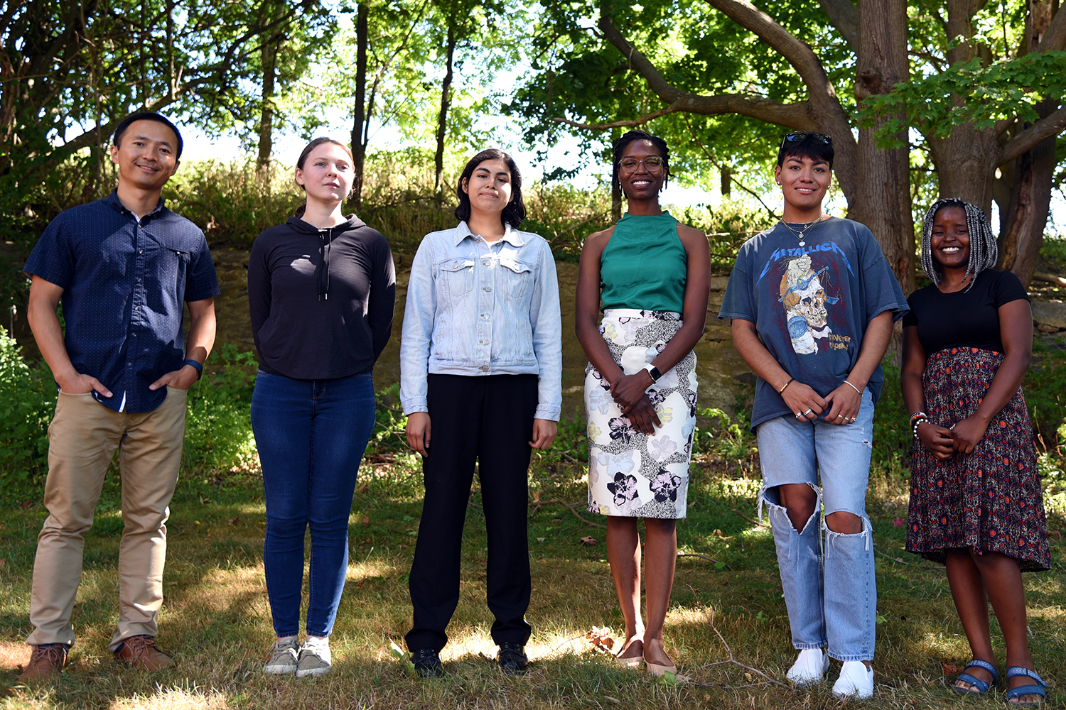 The Bridging the Gap program leaders, Yangchao Luo and Loneke Blackman Carr, pose with students for a photo outside the Roy E. Jones Building.